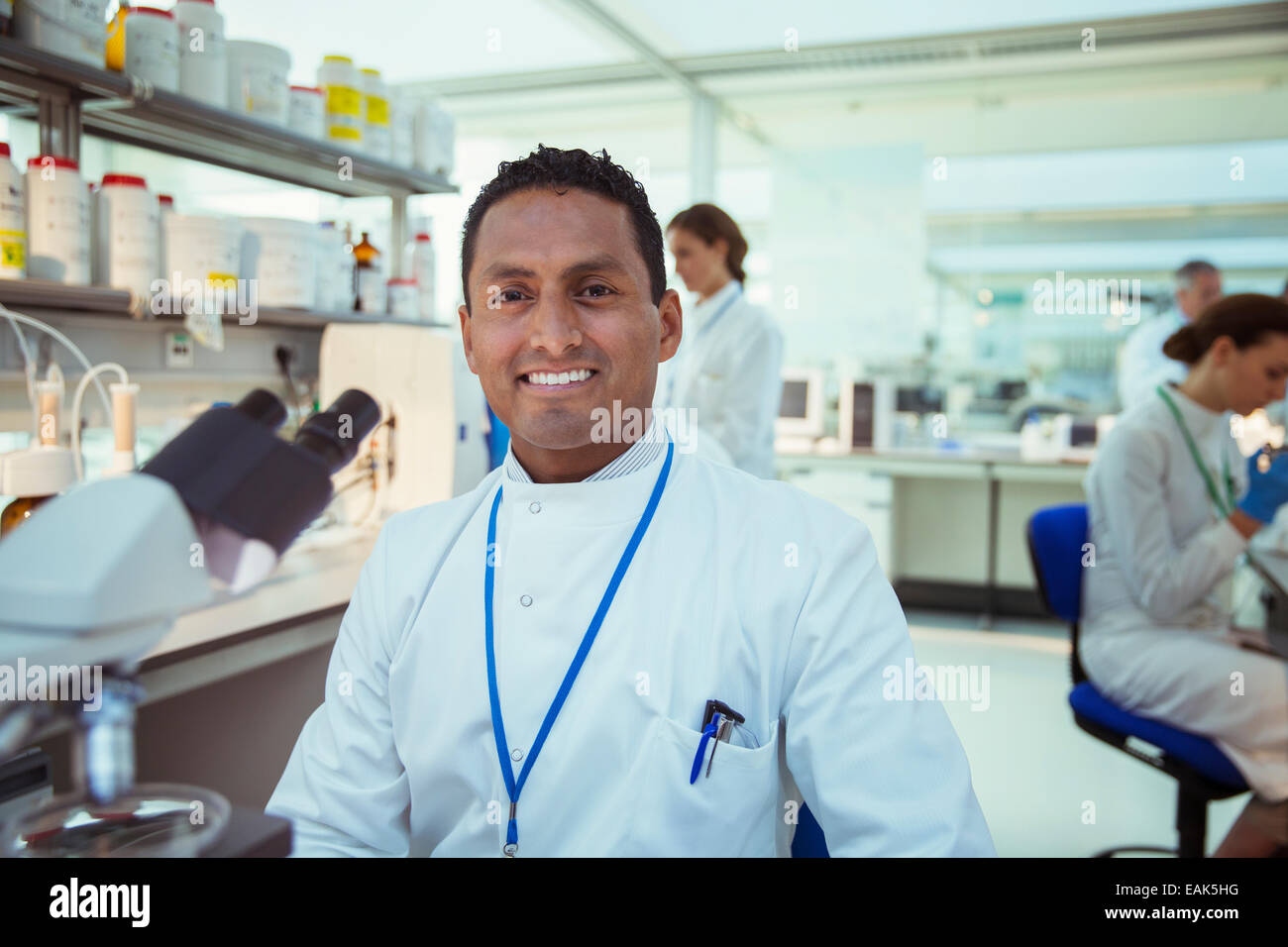 Scientist smiling in laboratory Stock Photo
