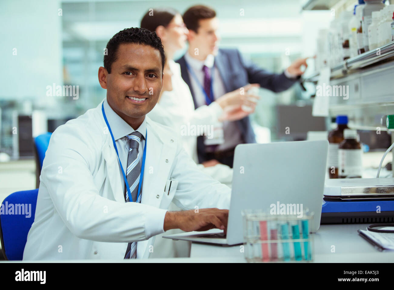 Scientist working on laptop in laboratory Stock Photo