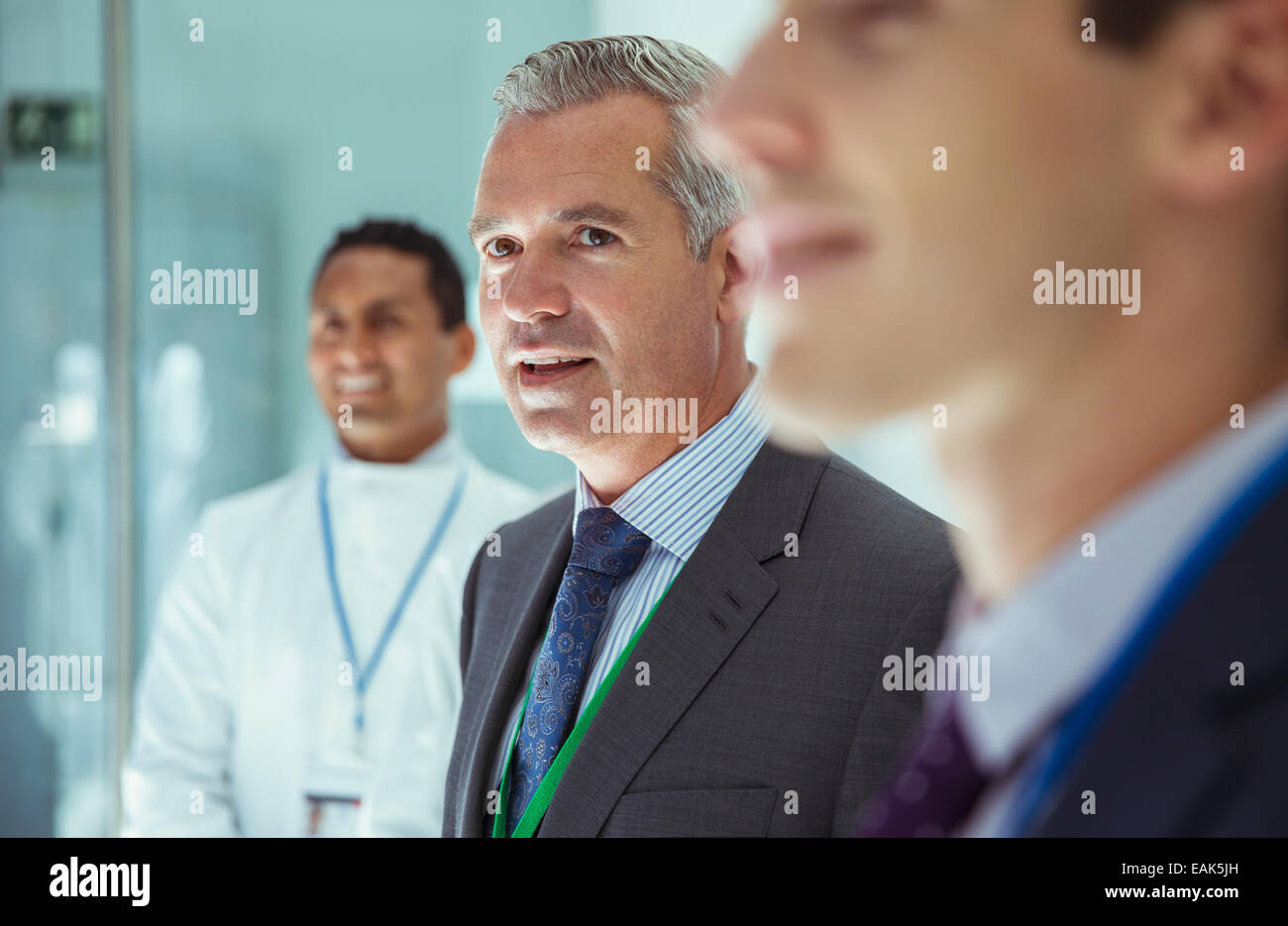 Scientist and businessmen in laboratory Stock Photo