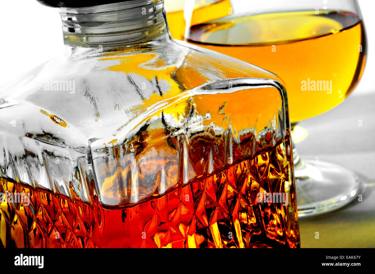closeup of a vintage glass liquor bottle and some cognac glasses with liquor Stock Photo Alamy