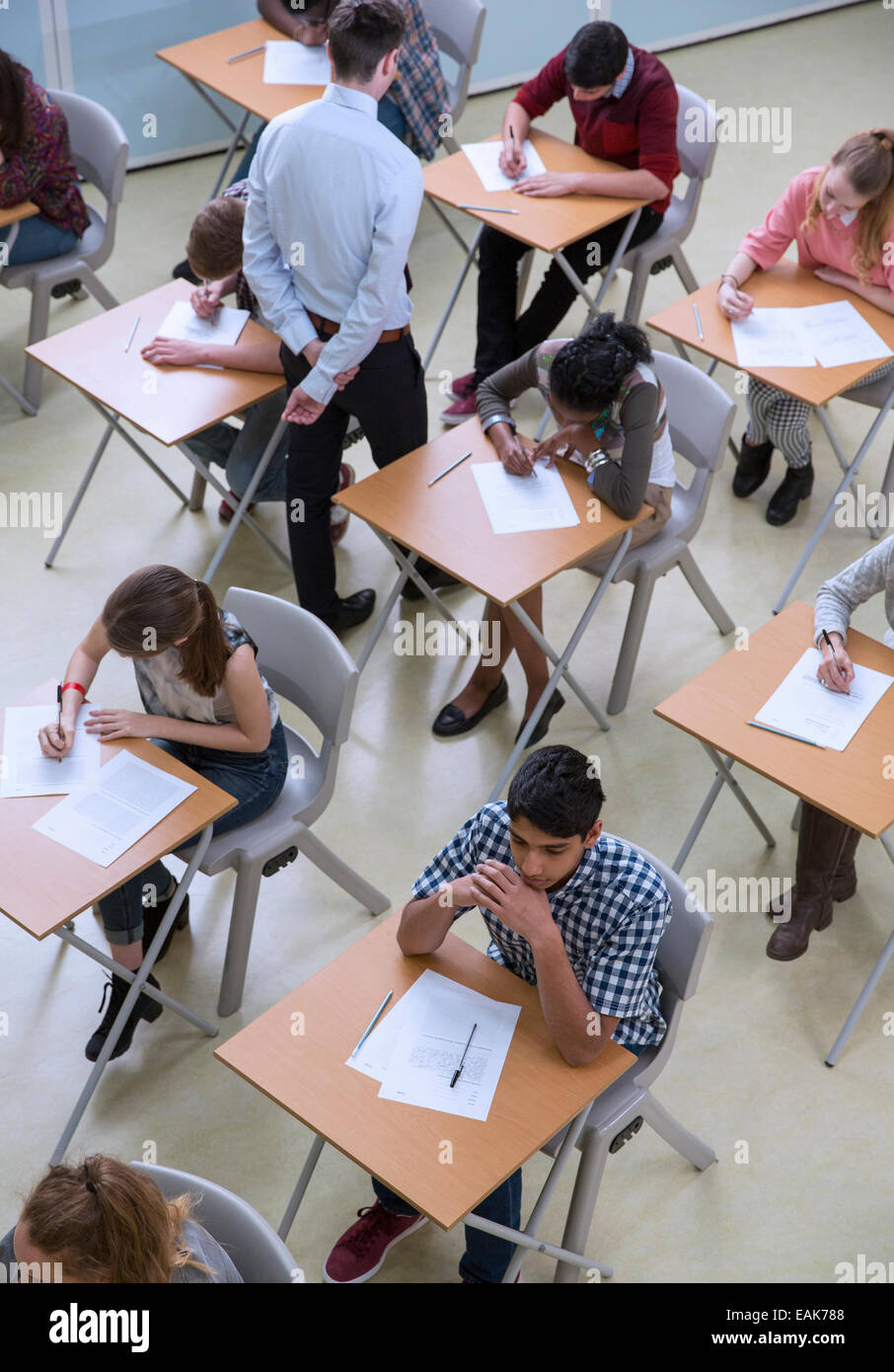 Elevated view of students writing their GCSE exam Stock Photo