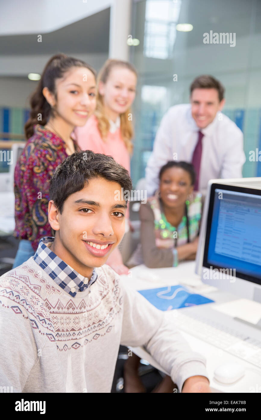 Teacher and students posing during IT lesson Stock Photo