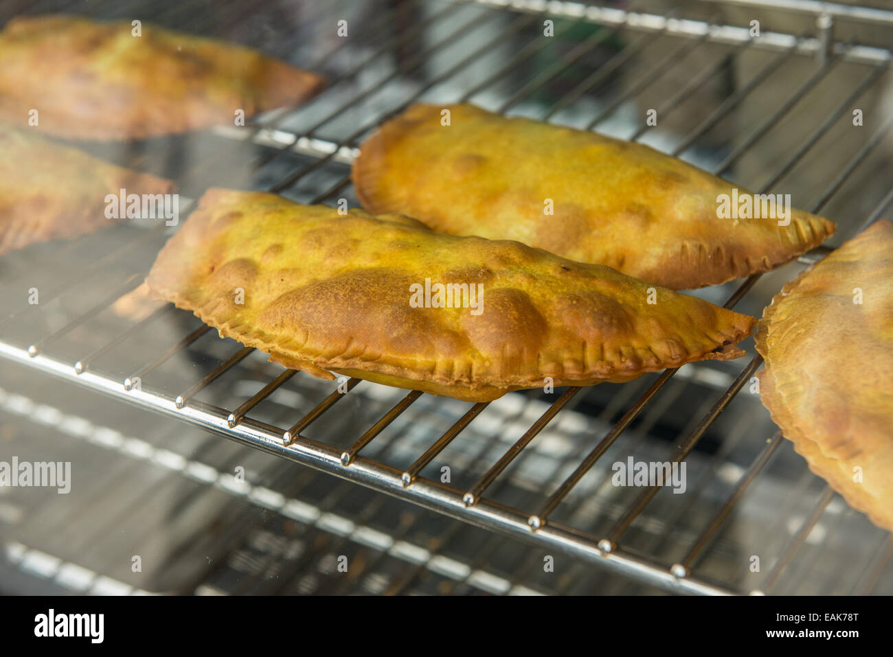 https://c8.alamy.com/comp/EAK78T/jamaican-patty-traditional-meal-pastry-with-meat-and-spieces-filling-EAK78T.jpg