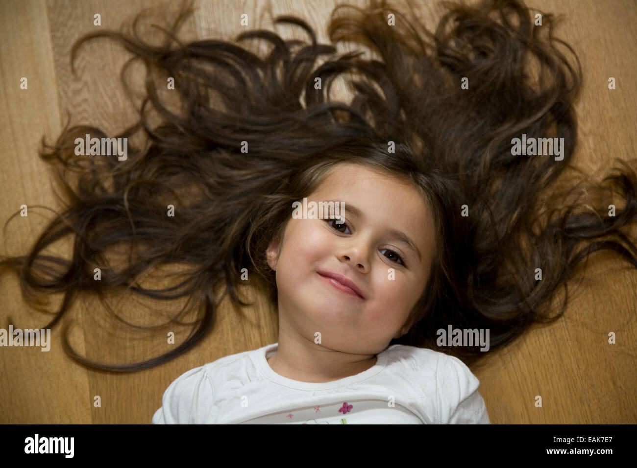 Portrait of girl lying on her back Stock Photo