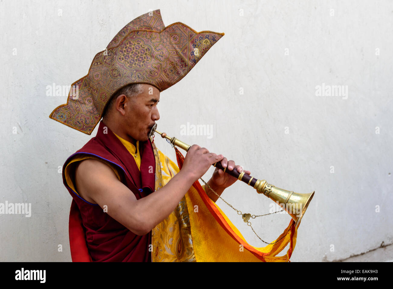 Monk making music as part of the opening ceremony of the Hemis Festival, Hemis, Ladakh, Jammu and Kashmir, India Stock Photo
