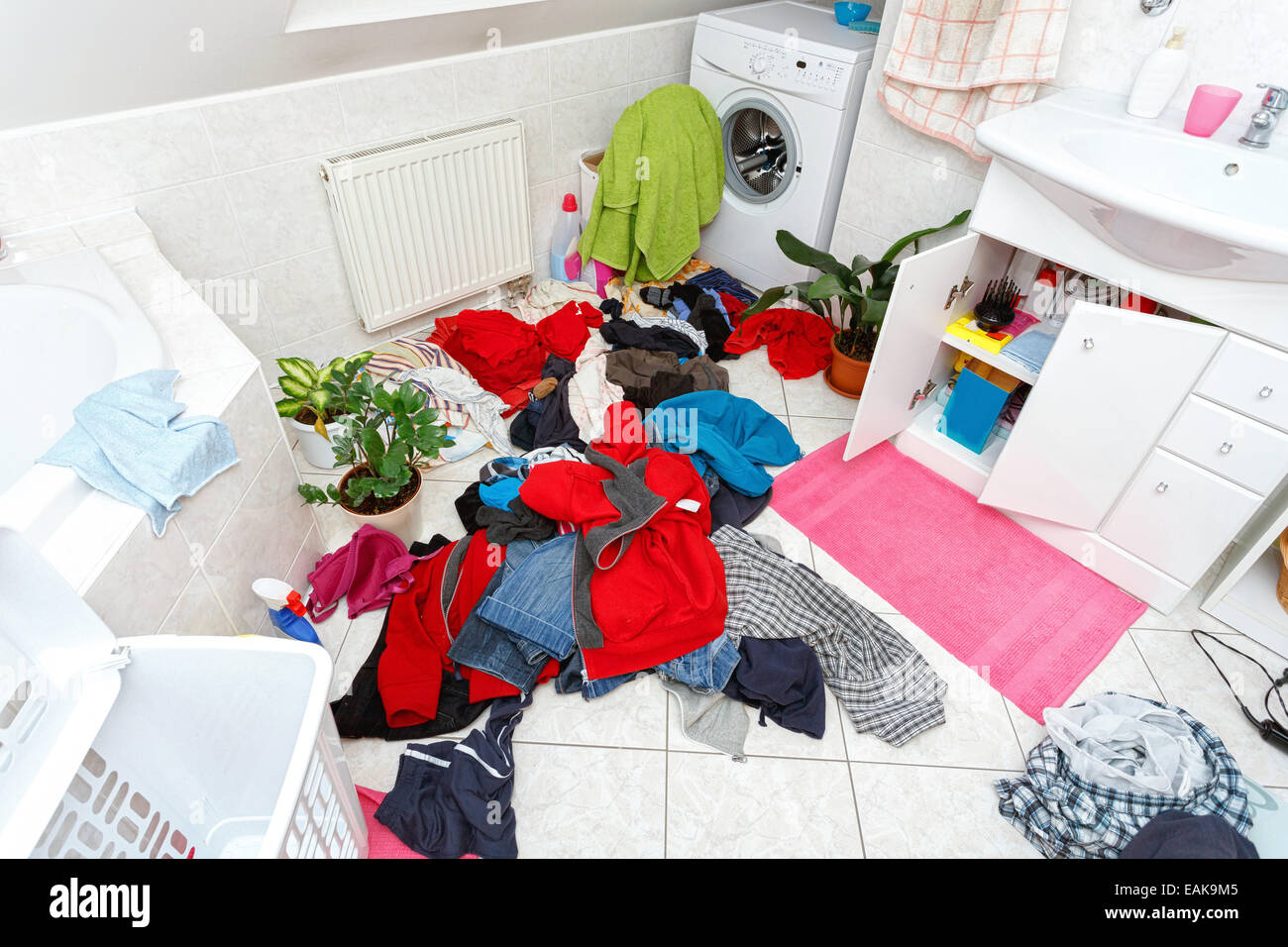 pile of dirty clothes ready for the wash in home bathroom Stock Photo