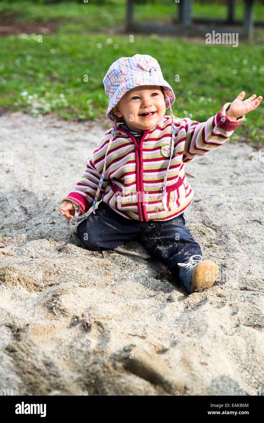 Baby, 12-14 Months, playing in the sand Stock Photo