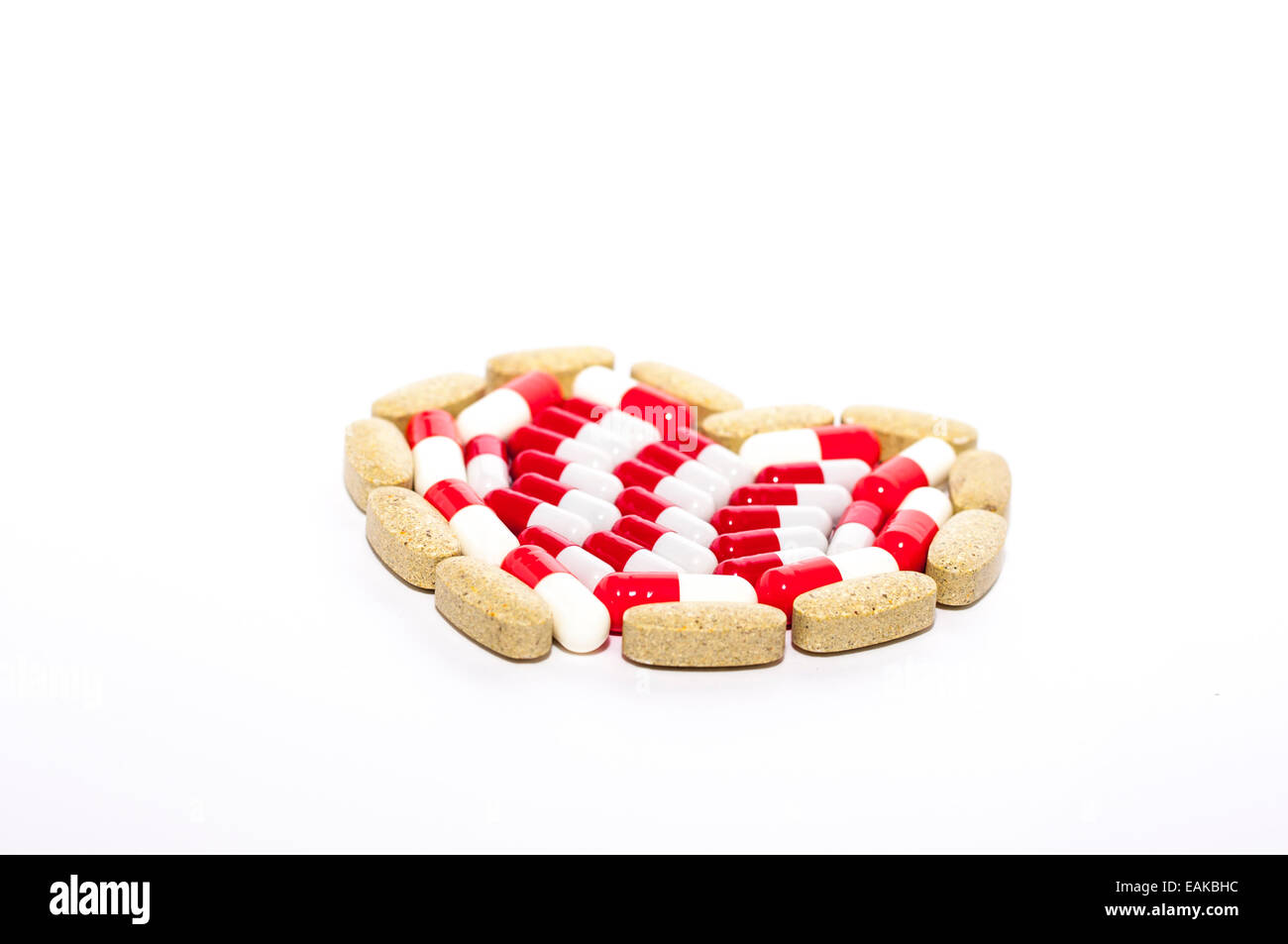 Heart of Pills on white background Stock Photo