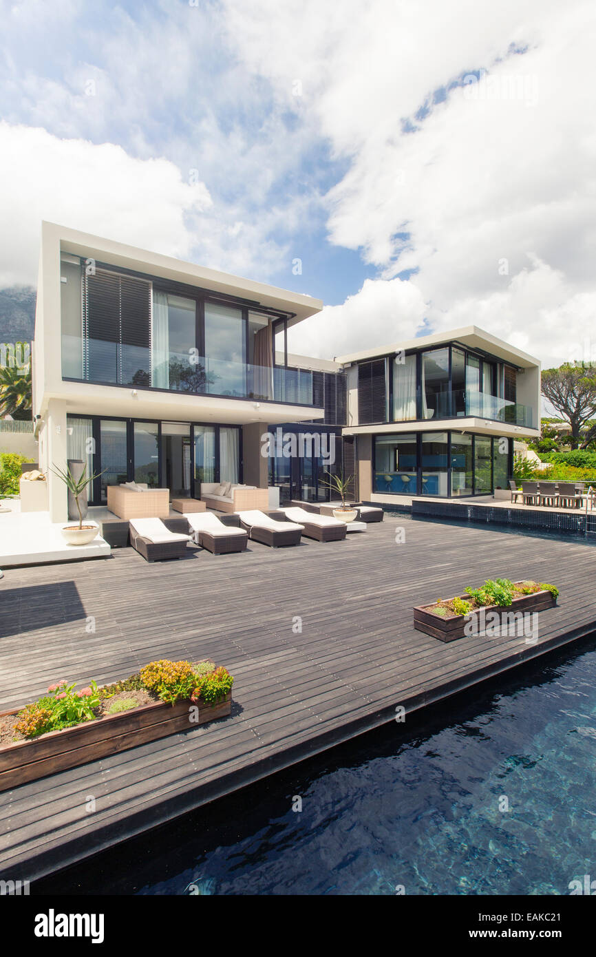 Modern house with large deck and swimming pool Stock Photo