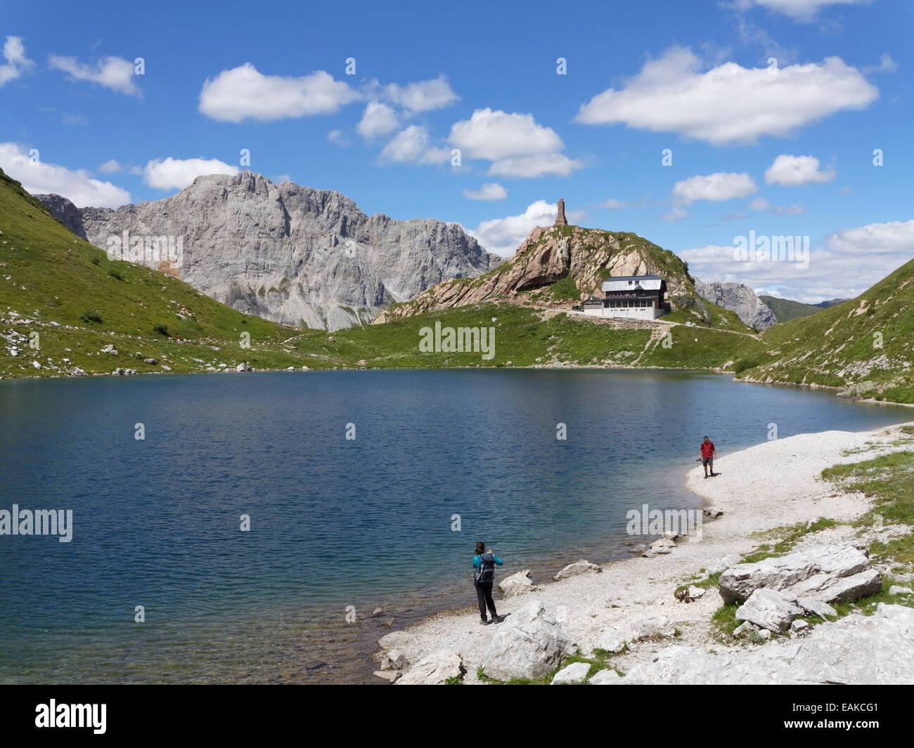 Wolayer Lake or Wolayersee with Wolayersee hut and war memorial, Carnic Alps, Lesachtal, Bezirk Hermagor, Kärnten, Italy Stock Photo