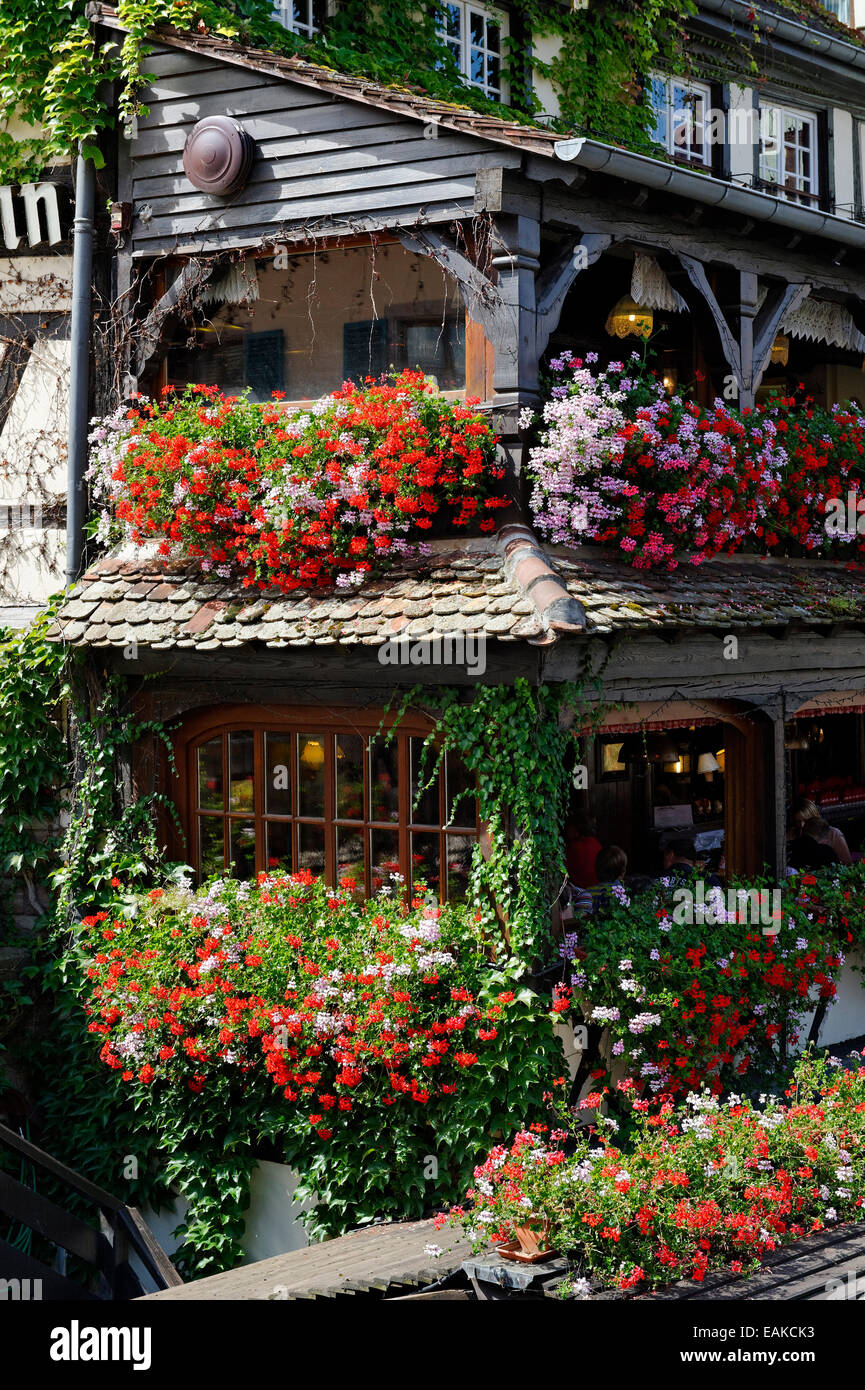 Flower arrangement on Restauraunt Pont St. Martin, Petite-France, Strasbourg, Département Bas-Rhin, Alsace, France Stock Photo