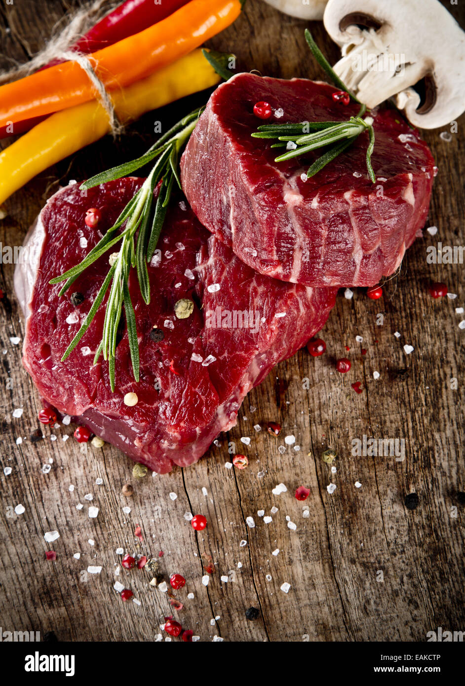 Fresh raw beef steak on wood Stock Photo