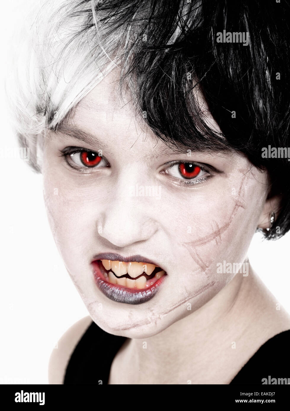 Portrait of a Young Girl in Wig Posing as Vampire Stock Photo