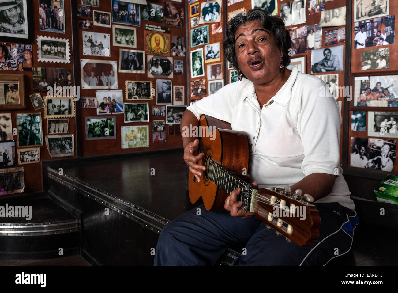 Female Cuban musician playing the guitar in a Casa de la Trova, Santiago de Cuba, Cuba Stock Photo