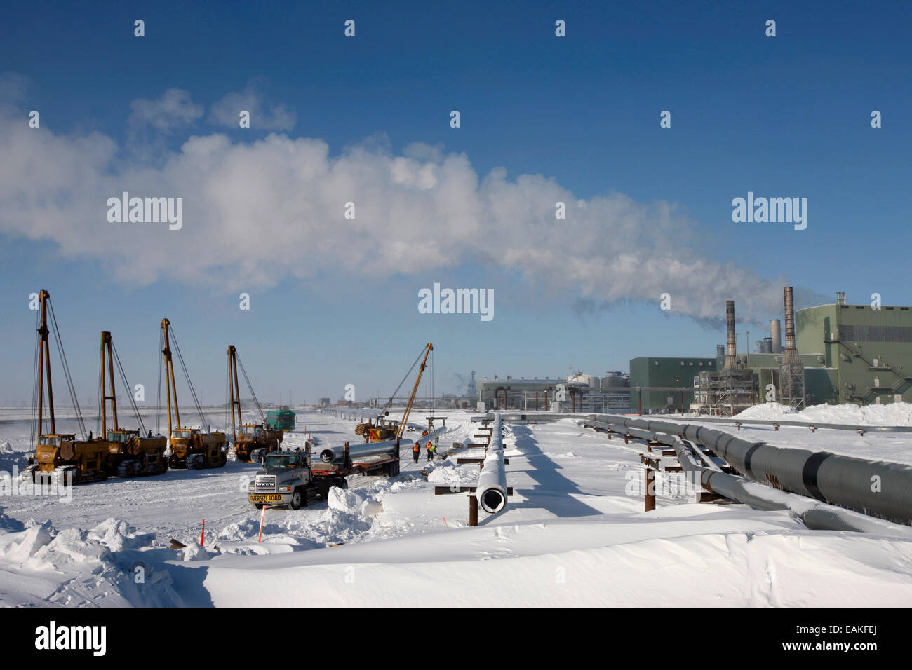 Cranes, Sidebooms, And Trucks All Available For Pipeline Work At Prudhoe Bay, Arctic Alaska, Winter Stock Photo