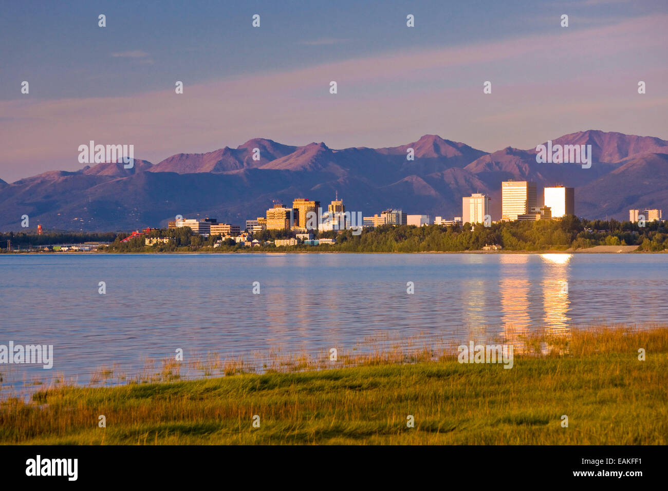 The Downtown Anchorage Skyline Reflected In The Water At High Tide At