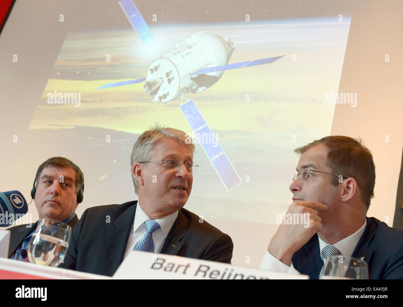 Berlin, Germany. 17th Nov, 2014. Bart Reijnen (R-L), site director of Airbus Defence and Space Bremen, Thomas Reiter, leader of Human Spaceflight and Operations at the European Space Agency (ESA), and NASA deputy director of the Johnson Space Center, Kirk Shireman, at a press conference for a contract signing in Berlin, Germany, 17 November 2014. With the 390-million Euro contract, Europe will deliver critical elements for an American space travel project. Airbus will develop a module for the American space capsule, Orion. Photo: RAINER JENSEN/dpa/Alamy Live News Stock Photo