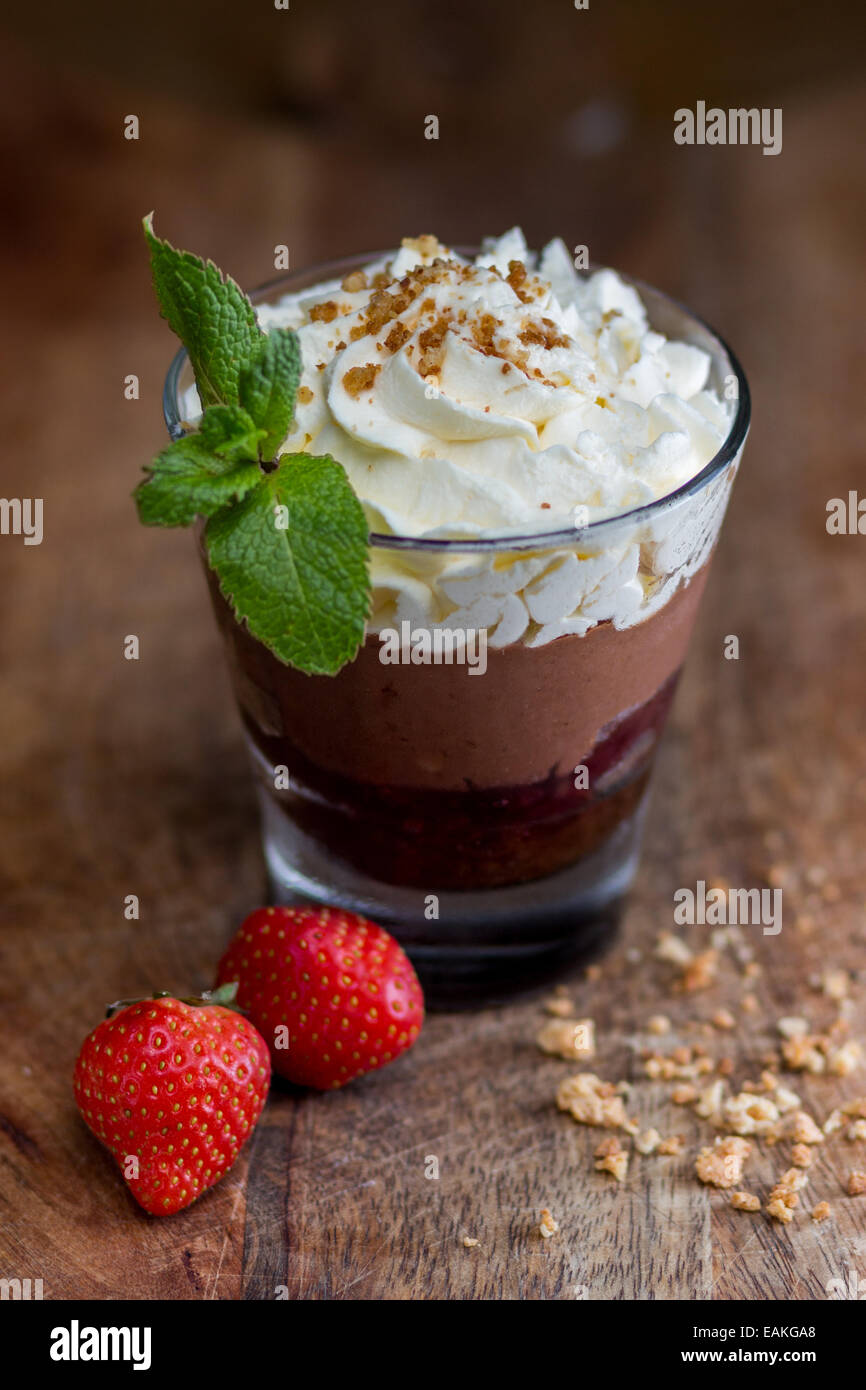 Chocolate and strawberry mousse with biscuit crumbs Stock Photo