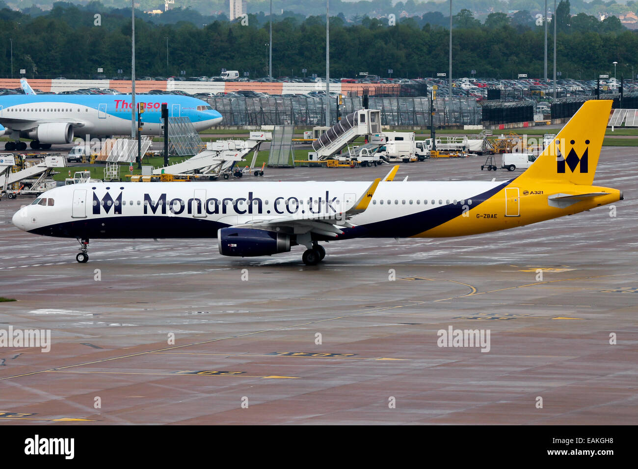 Monarch Airlines Airbus A321 taxis to the active runway at Manchester Airport. Stock Photo