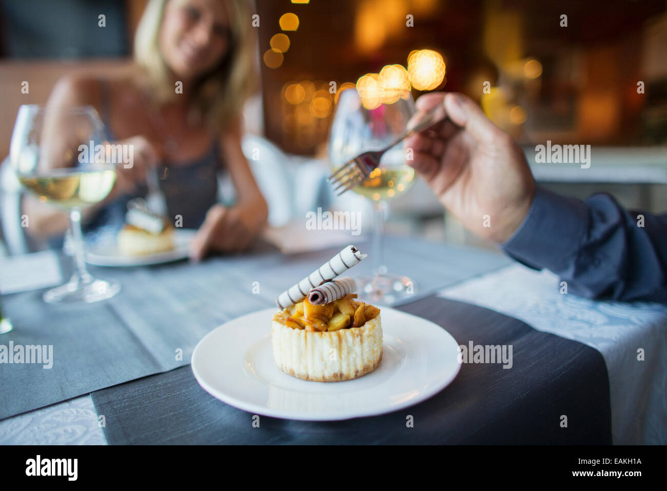 Couple eating dessert in fancy restaurant Stock Photo Alamy