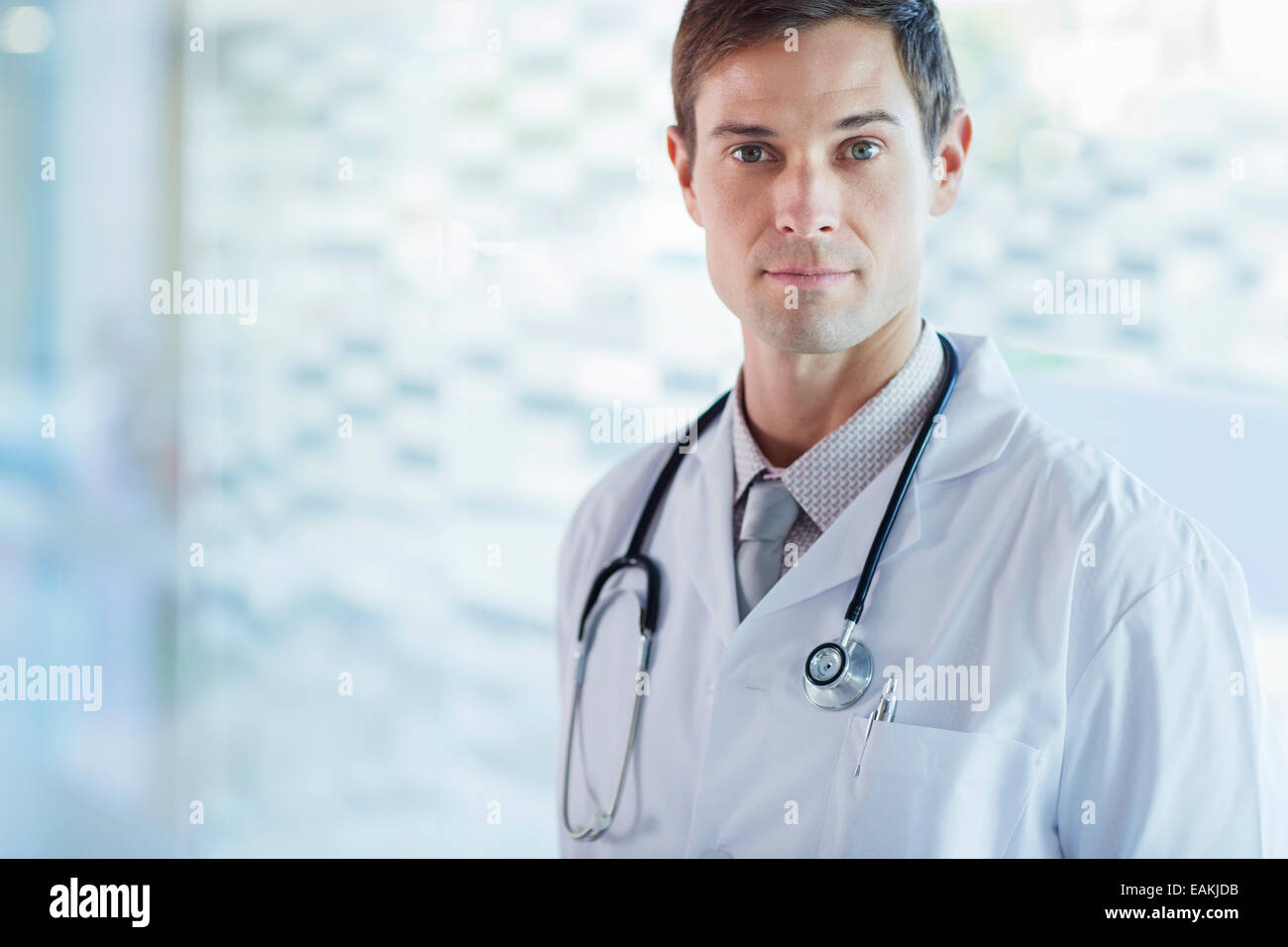 Portrait of confident doctor wearing lab coat Stock Photo Alamy