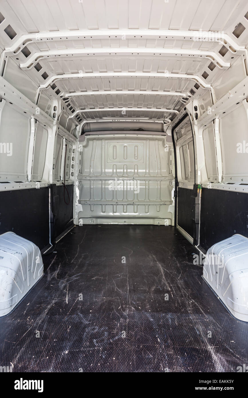 interior of the empty load compartment of a white van Stock Photo