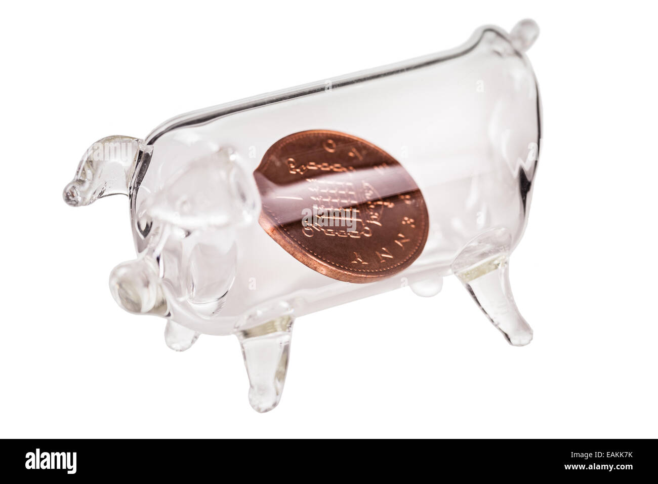 a glass piggy bank with a penny inside isolated over a pure white ...