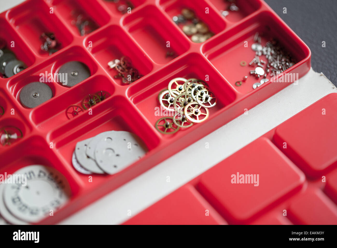 Assortment of Watch-parts in a red box Stock Photo