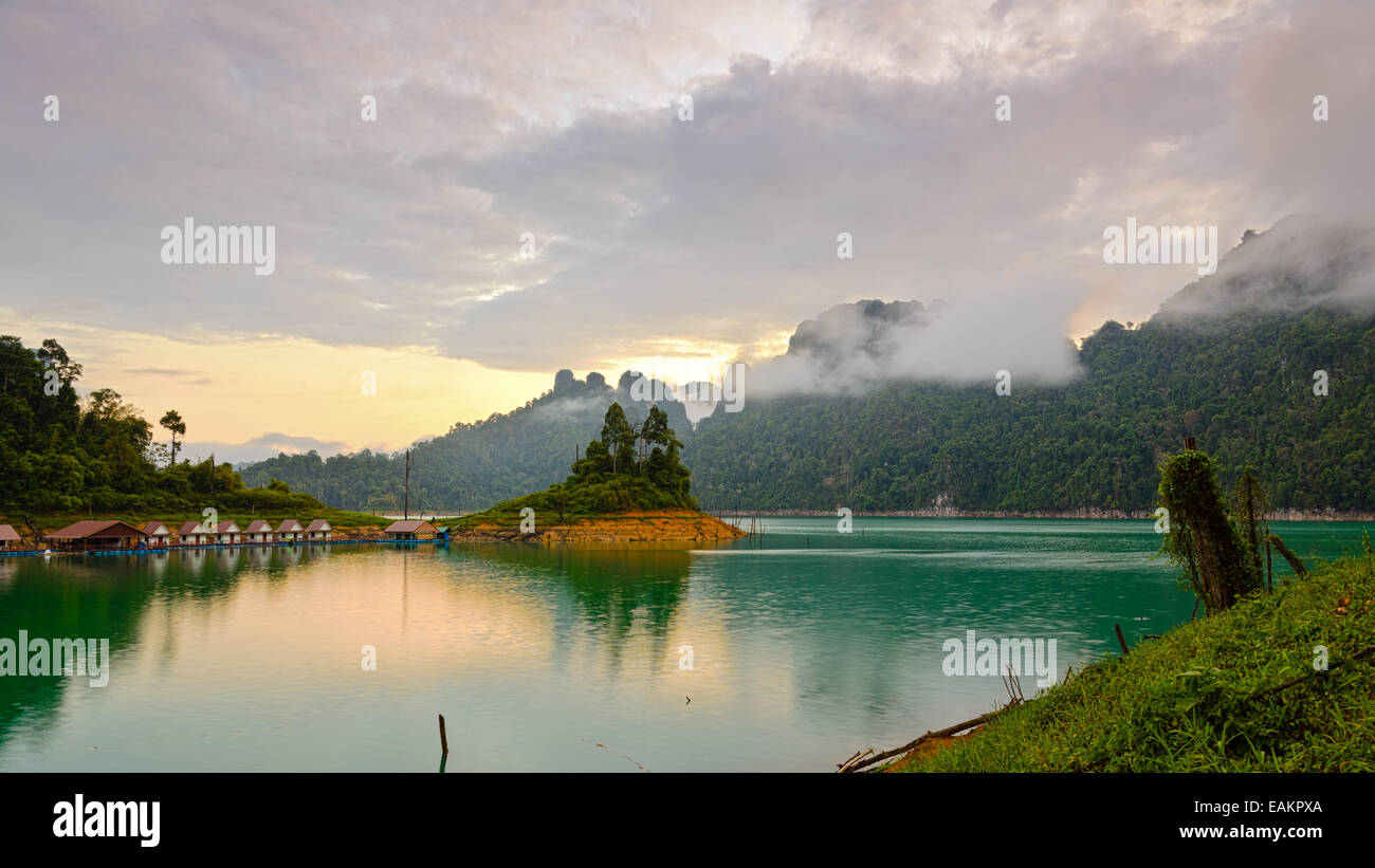 Bungalows mountains and lake in the sunrise at Ratchaprapha Dam, Khao Sok National Park, Surat Thani Province, Thailand Stock Photo