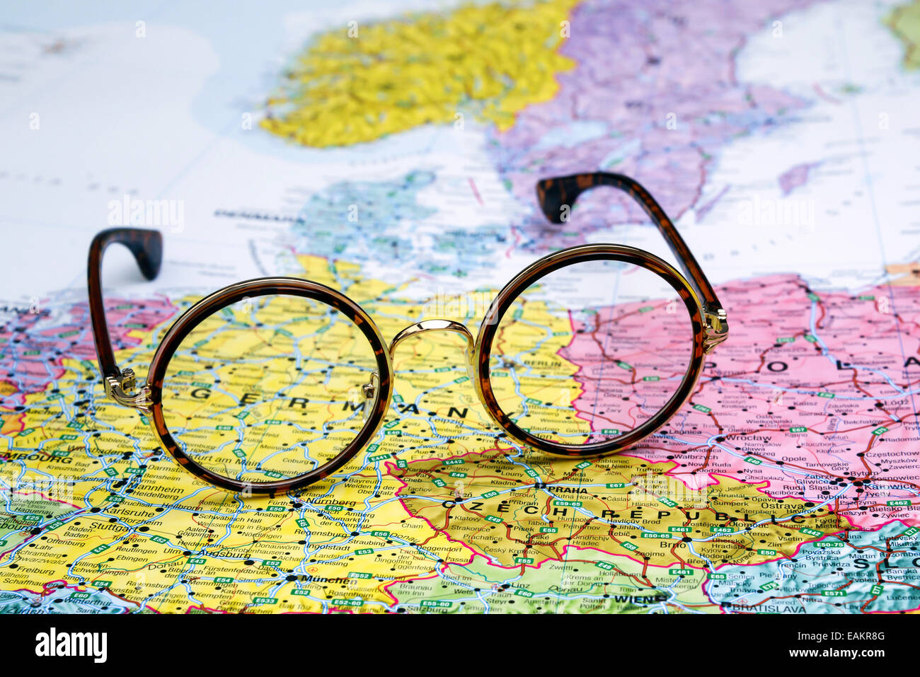 Glasses on a map of europe Germany - Glasses On A Map Of Europe Germany EAKR8G 