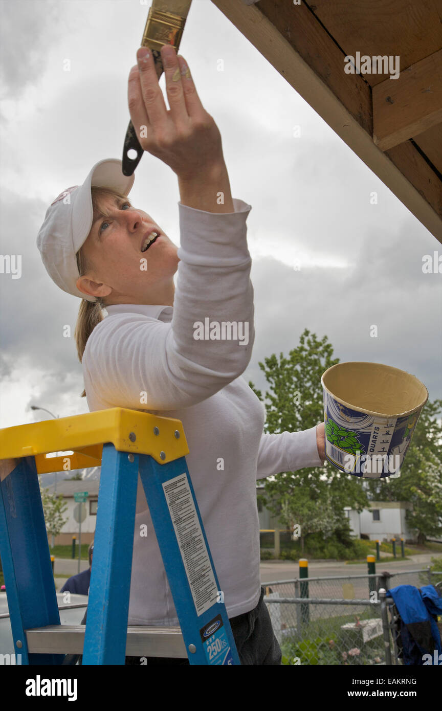 Rotary Club Participant Helps Paint A House In The Anchorage