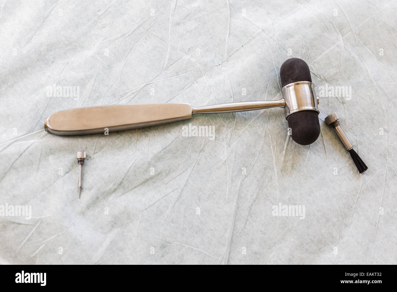 A reflex hammer is a medical instrument used by physicians to test deep tendon reflexes Stock Photo
