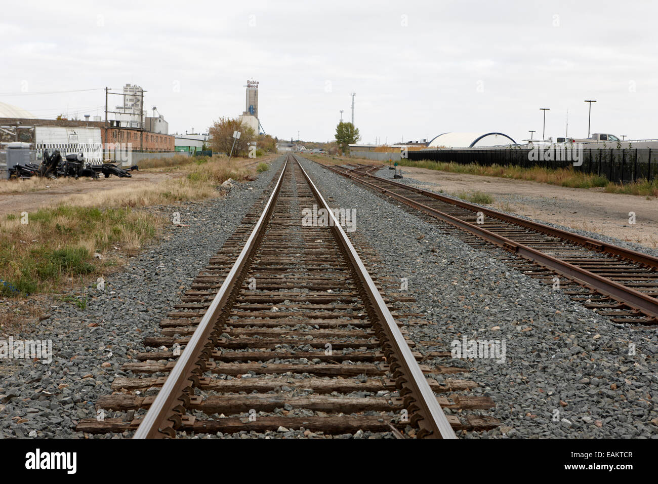 railway lines through industrial area of saskatoon Saskatchewan Canada Stock Photo