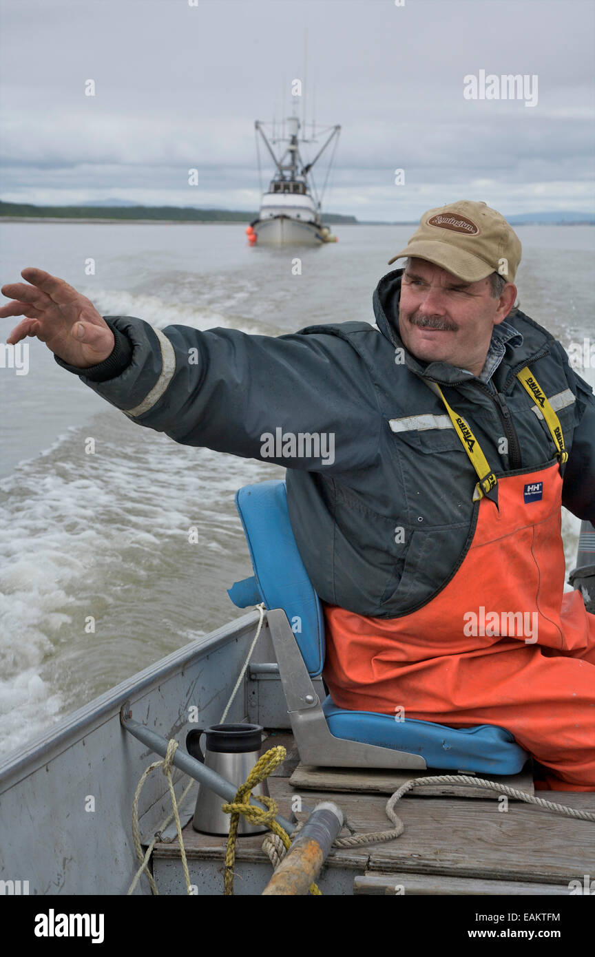 Commercial Fisherman Waves To Other Boats During Fishing Season In