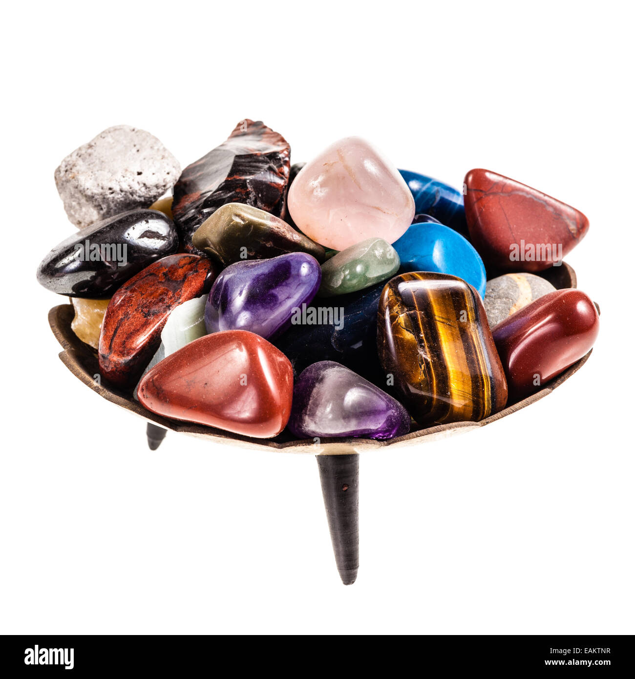 a heap of colorful stones and minerals isolated over a pure white background Stock Photo
