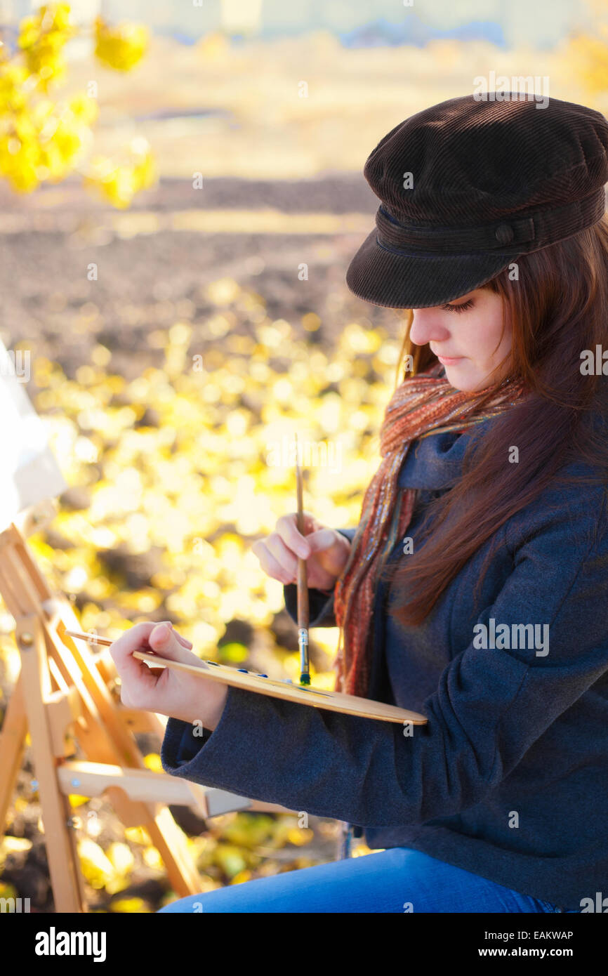 Woman artist with palette and brush in hand Stock Photo - Alamy