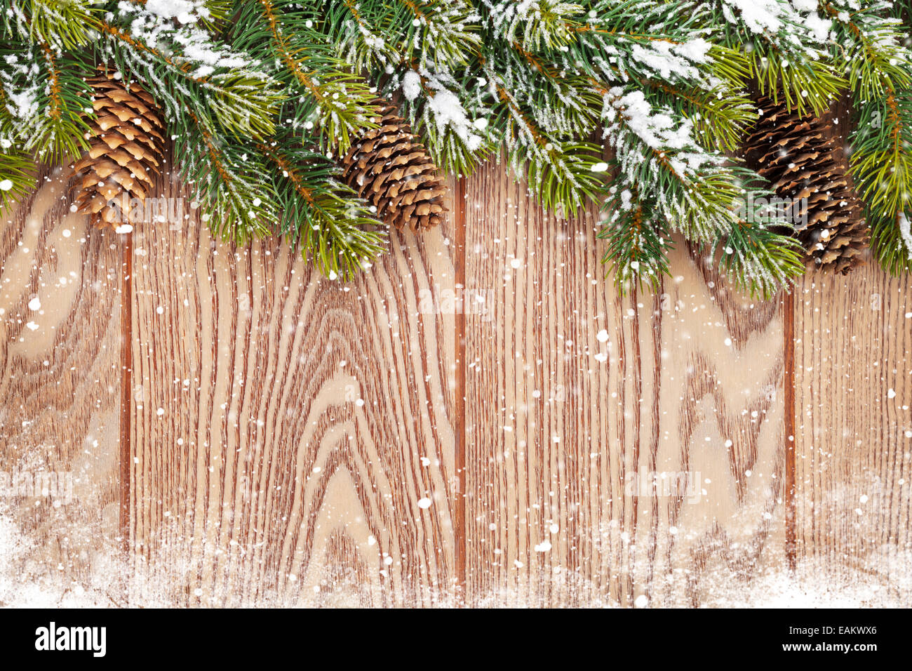 Christmas wooden background with snow fir tree and pinecones Stock ...