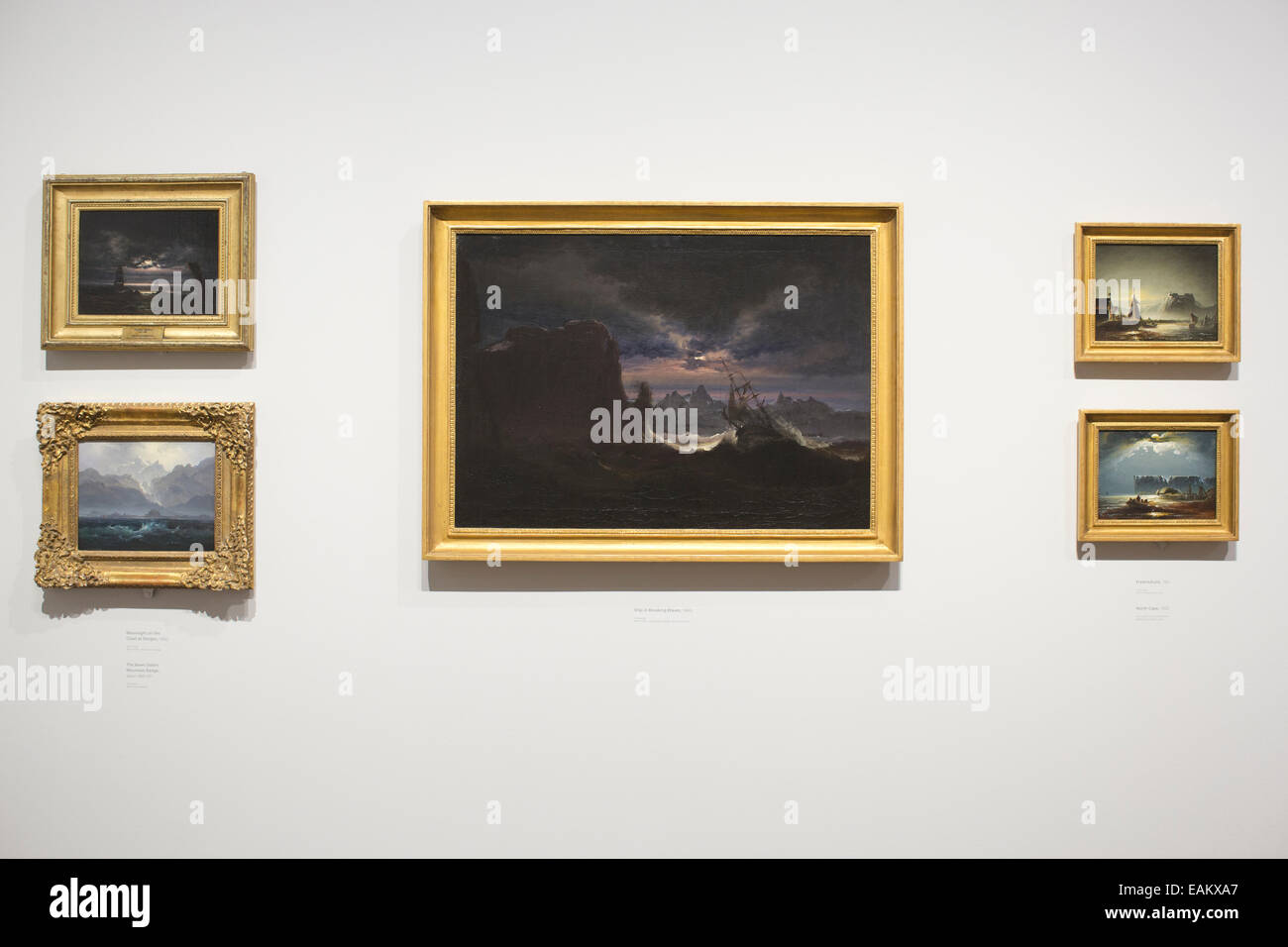 Peder Balke exhibition National Gallery, London, UK 11th November 2014.  (left to right) 'Moonlight on the Coast at Steigen', 1842, oil on canvas, 'The Seven Sisters Mountain Range' about 1845-50, 'Ship in Breaking Waves' 1840's, 'Fredrikshald' 1852, and 'North Cape' 1852. Peder Balke is among the most pioneering painters of 19th-century Scandinavia. Credit:  Jeff Gilbert/Alamy Live News Stock Photo
