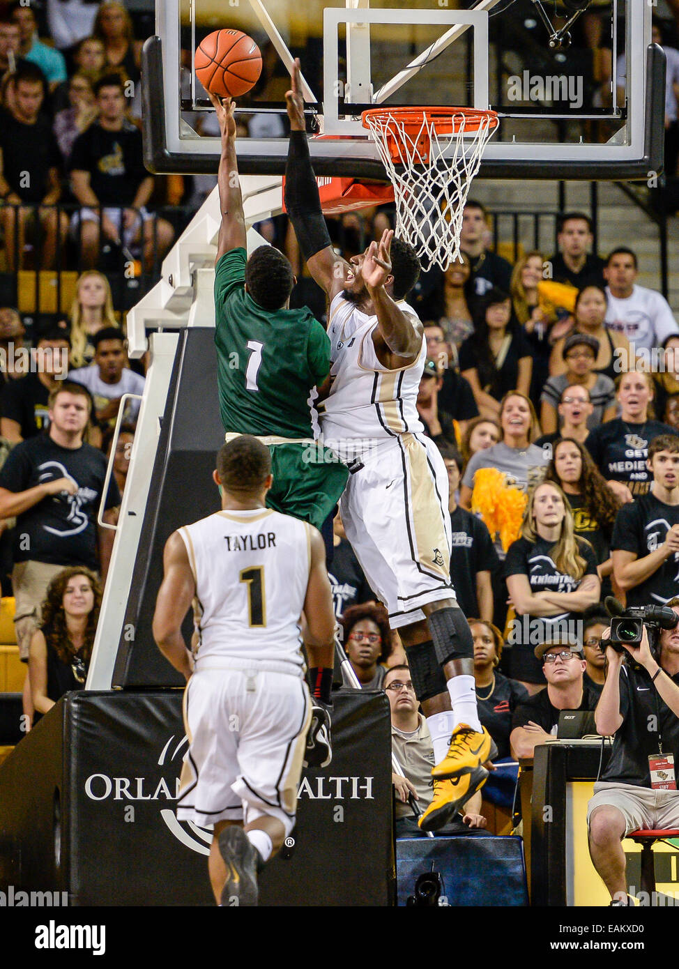 November 16, 2014 - Orlando, FL, U.S: UCF Knights forward Staphon Blair (52) blocks the ball on a layup attempt by Stetson Hatters guard Divine Myles (1) during 2nd half mens NCAA basketball game action between the Stetson Hatters and the UCF Knights. UCF defeated Stetson 64-55 at CFE Arena in Orlando, Fl. Stock Photo
