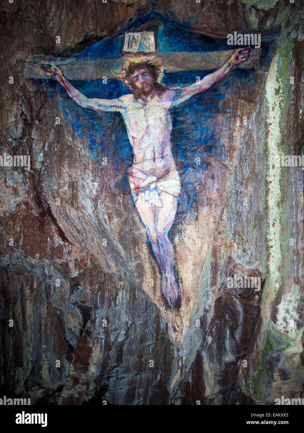 Painting in a cave of Jesus Christ on the cross Stock Photo