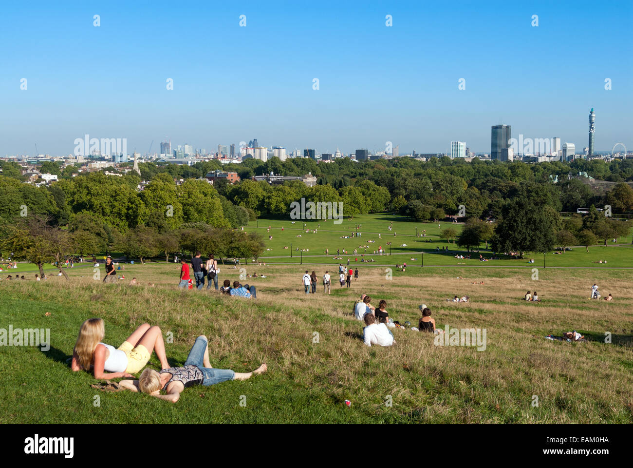 People relaxing on summer day in Primrose Hill, London, England, UK Stock Photo