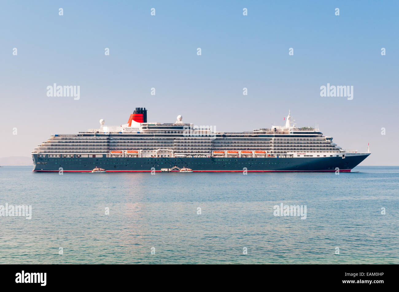 The Queen Victoria cruise ship moored off Mykonos, Greece Stock Photo