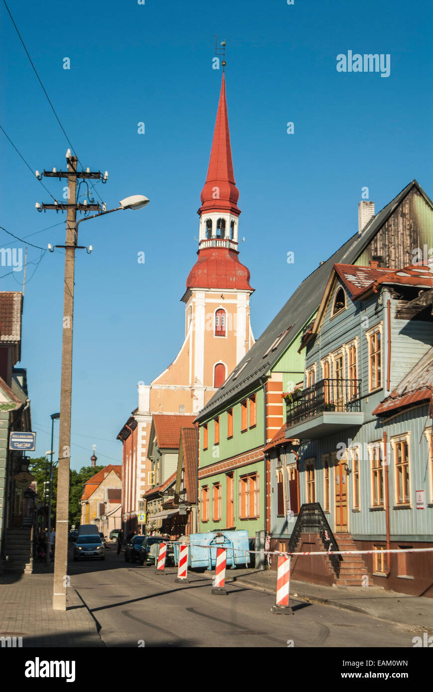 The old town centre in Parnu, Paernu, western town of Estonia by the sea. Beautiful old style wooden church tower,sunny street. Stock Photo