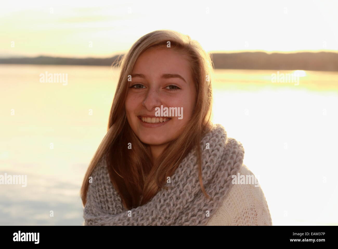 Pretty girl in autumn by the lake, horizontal Stock Photo