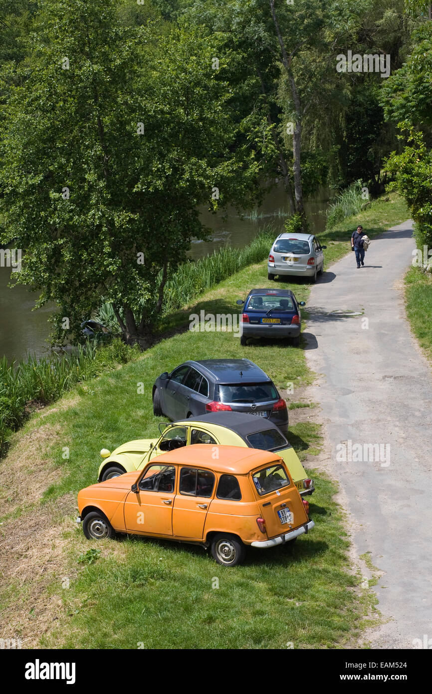 Cars parked by the river at Angles sur L' Anglin. Stock Photo