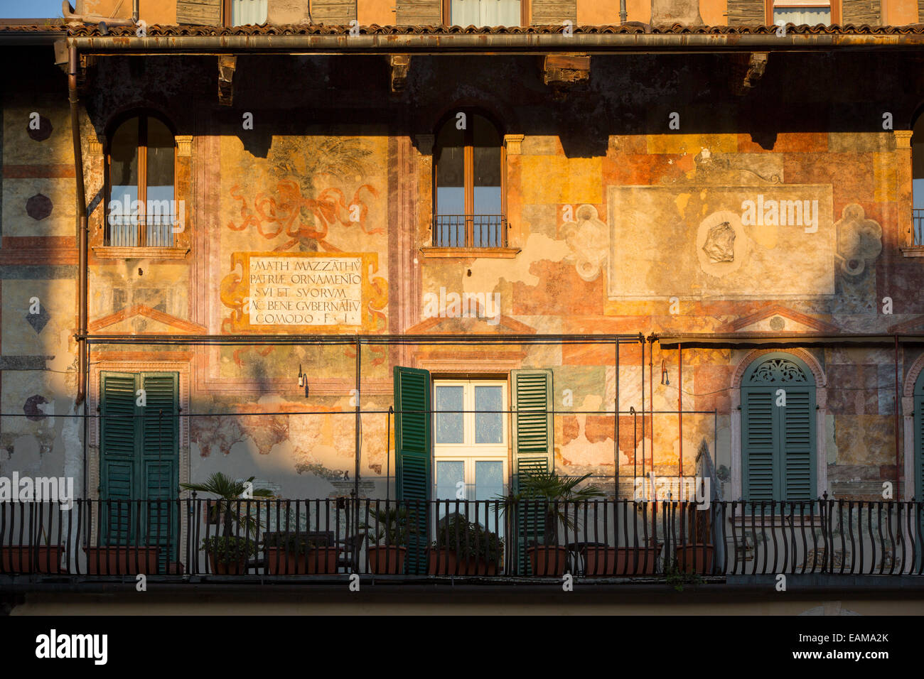 Setting sunlight on the historic buildings surrounding Piazza delle Erbe, Verona, Veneto, Italy Stock Photo