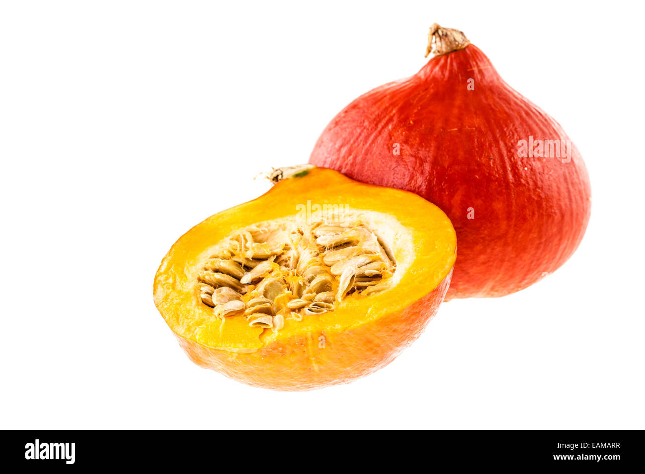 red kuri squash, small pumpkin with a halved one isolated over a white background Stock Photo