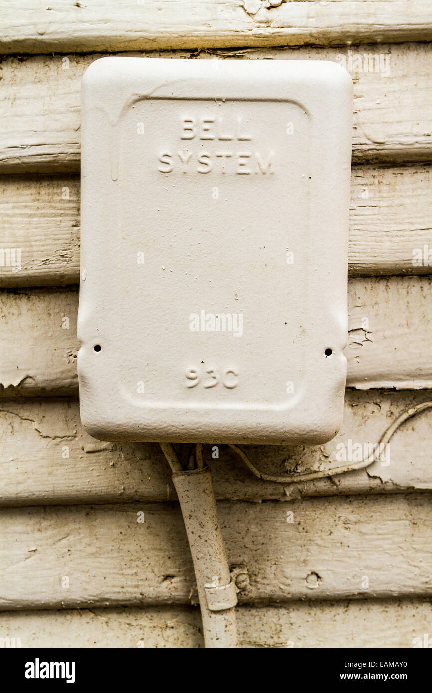 A very old Bell System protector for telephone service which prevents power surges and lightning strike voltages from entering Stock Photo
