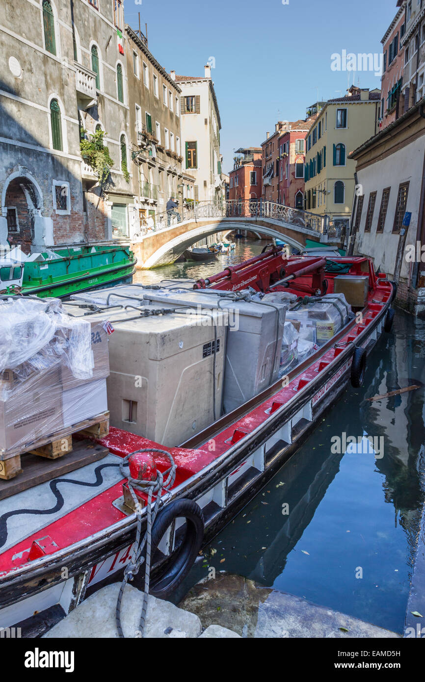 Workboat on canal in Venice, Italy, Stock Photo