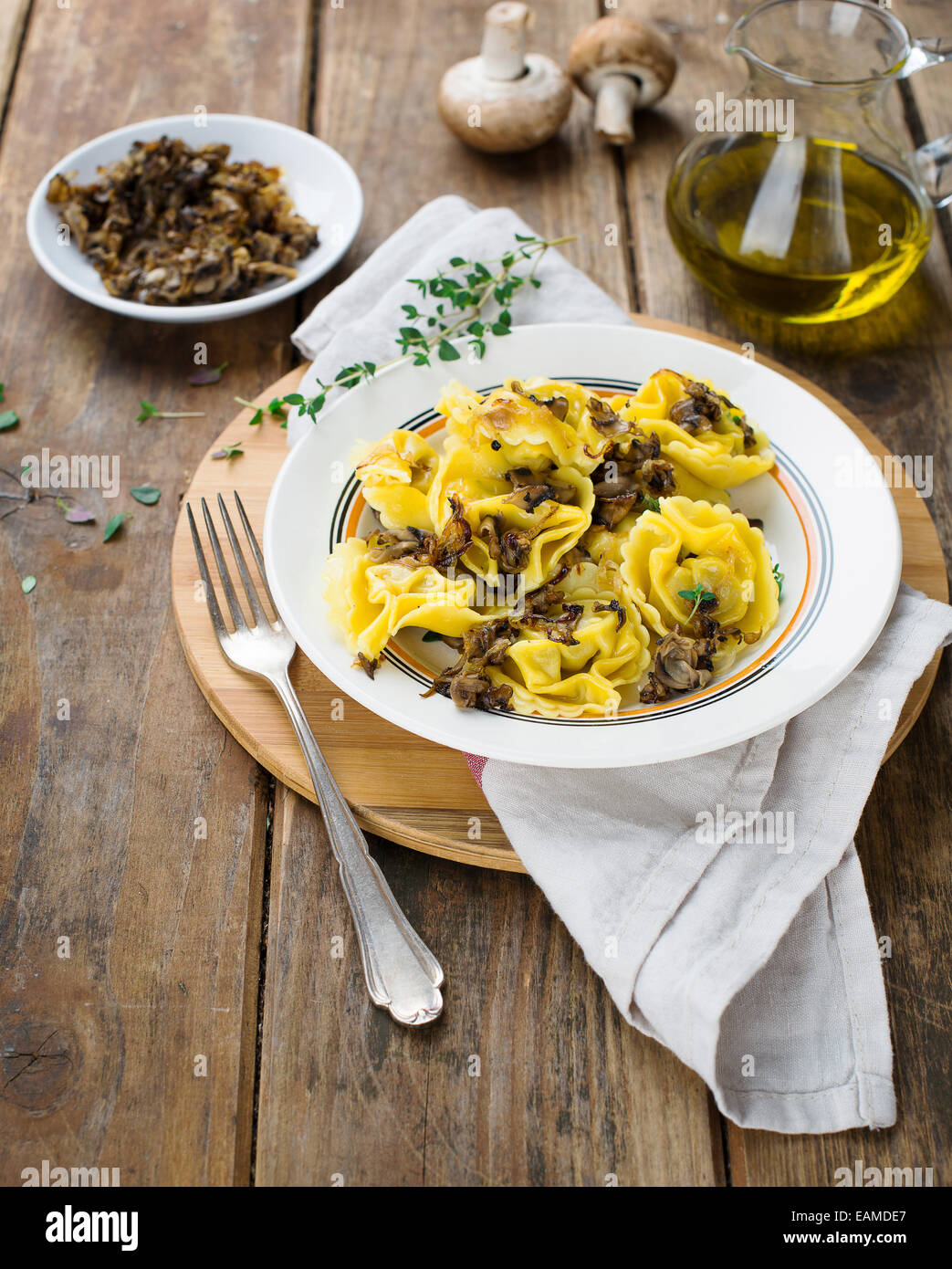 Tortelli Tortellini with grilled mushrooms and onions Stock Photo